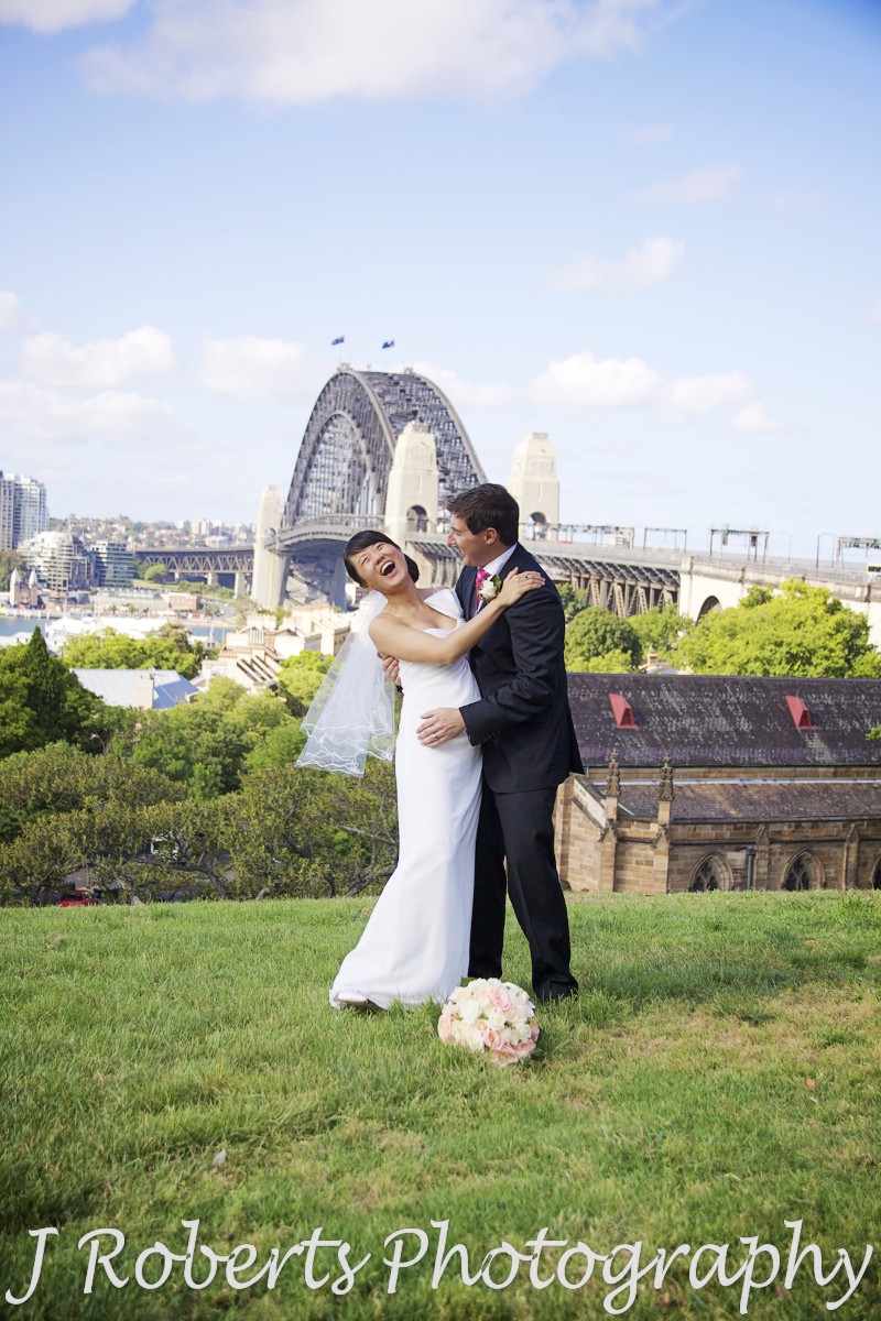 Couple in laughing embrace - wedding photography sydney